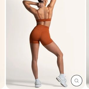 Lycit gym short shorts, essential raw edge, burnt orange brand new with tags